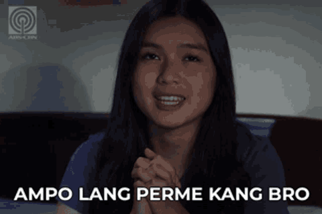 a woman with her hands folded and the words ampo lang perme kang bro