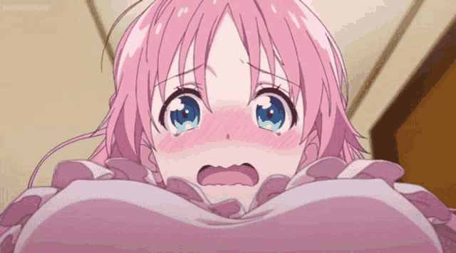 a girl with pink hair and blue eyes is looking up at her breasts