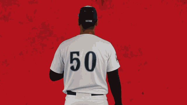 a baseball player wearing a jersey that says craw 50