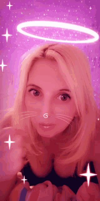 a woman with a nose ring and a g on her nose