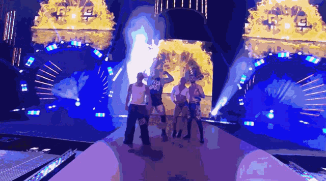 a group of people are standing on a stage and one of them is wearing a shirt that says ' jeep ' on it