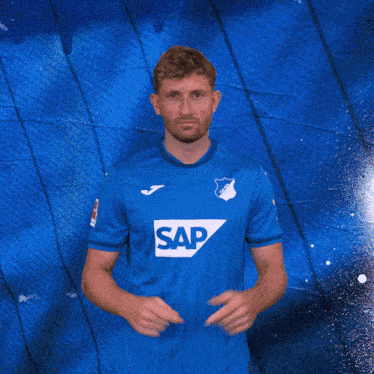 a man in a blue shirt with the word sap on the front