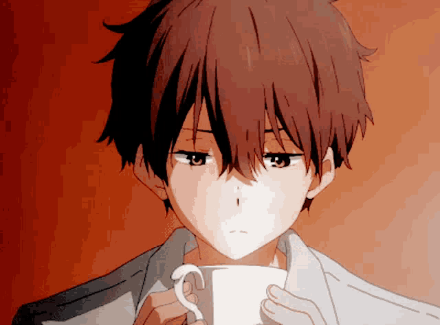 a boy with brown hair is holding a white cup