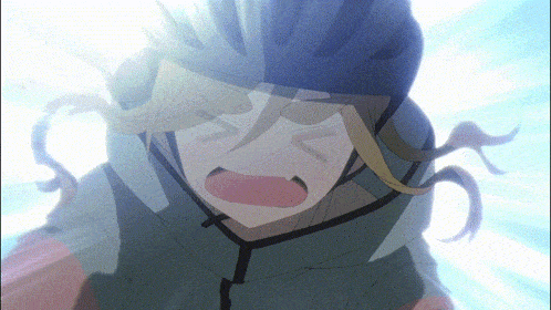 a close up of a person wearing a helmet making a funny face