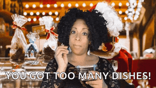 a woman in a santa hat says " you got too many dishes " while holding a cup of coffee