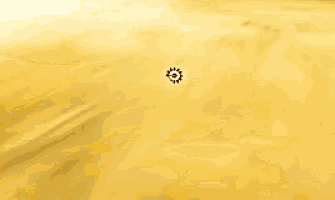 a yellow background with a black circle in the middle of it