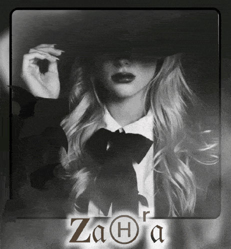 a black and white photo of a woman with the name zaha written on the bottom