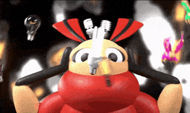 a red and yellow cartoon character with a light bulb in its mouth
