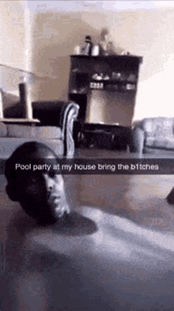 a man is laying on his back in a living room with a caption that says pool party at my house bring the bitches .