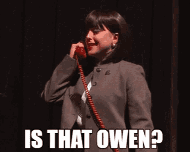 a woman talking on a red telephone with the words is that owen