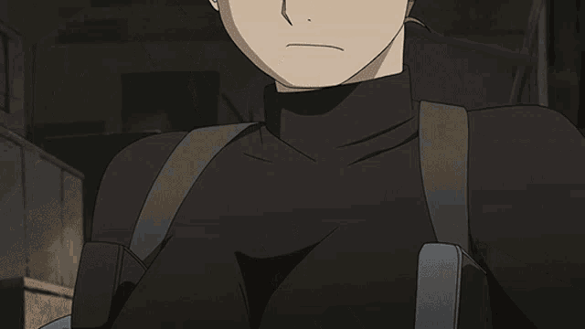 a close up of a person 's chest with a black shirt on