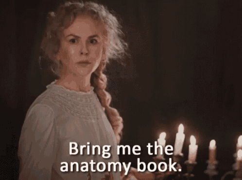 a woman stands in front of candles with the words bring me the anatomy book