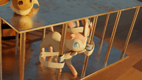 eevee and sylveon are tied up in a cage with a metal fence