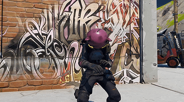 a forklift is parked in front of a brick wall with graffiti on it that says ' xerox ' on it
