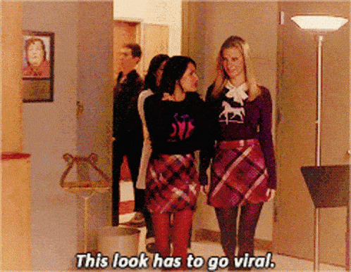 two women walking down a hallway with the words this look has to go viral below them