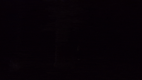 a black background with a few white dots on it .