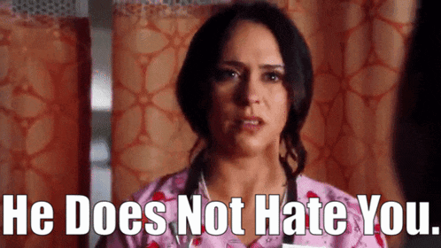a woman in a pink scrub top says he does not hate you ..