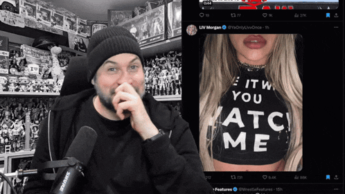 a man with a shure microphone in front of a picture of a woman