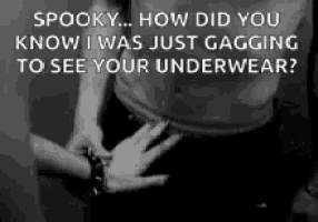 a black and white photo of a man 's underwear with a woman 's hand on it .