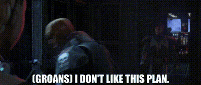 two men are talking to each other in a dark room and one of them is talking about groans .