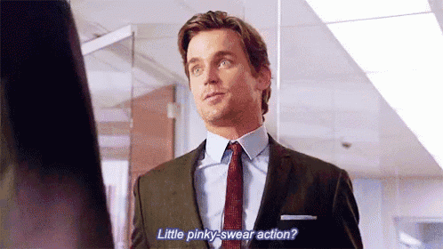 a man in a suit and tie is talking to another man in an office and says `` little pinky swear action ? ''