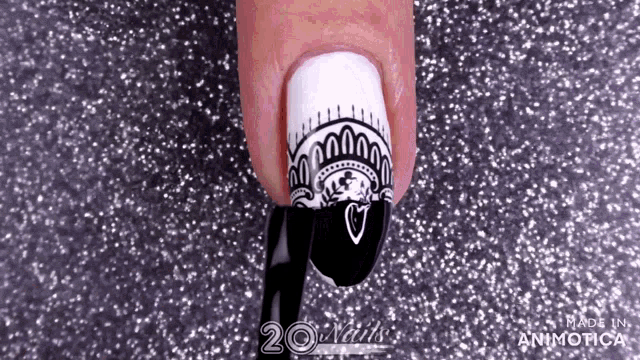 a close up of a person 's nails with the words made in aninotica