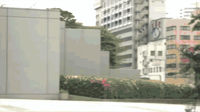 a clock on the side of a building shows the time as 1:20