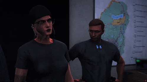 a man and a woman wearing under armour shirts are standing in front of a map
