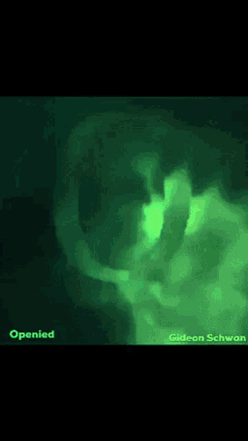 a green light is coming out of a person 's head ..