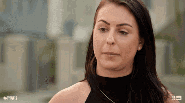 a woman with # mafs written on the bottom of her face
