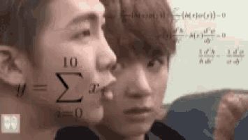 a couple of men standing next to each other with mathematical equations written on their faces .