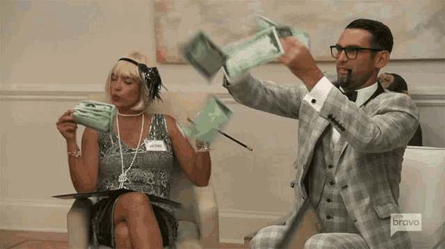 a man in a suit is throwing money in the air while a woman in a flapper dress is sitting in a chair