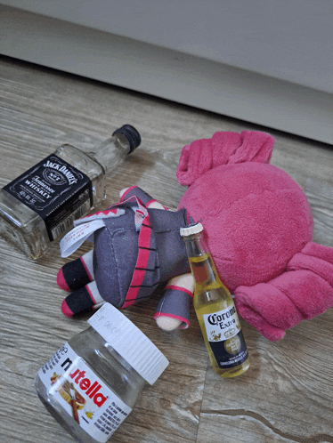 a bottle of jack daniels sits next to a bottle of corona
