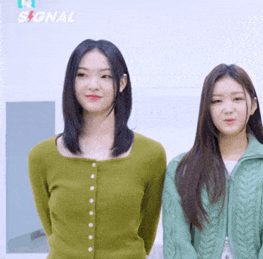 two girls are standing next to each other and the word signal is on the bottom