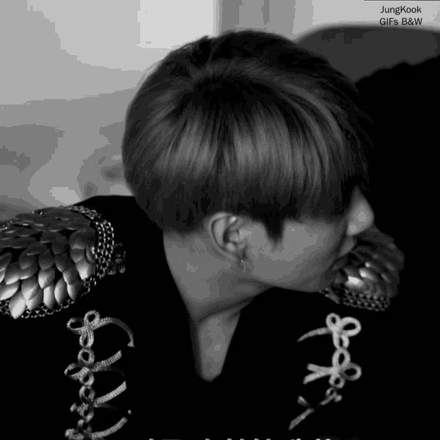 a black and white photo of a person with the name jungkook