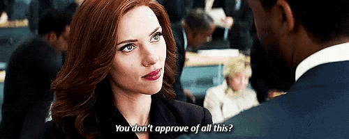 a woman is talking to a man in a suit and says `` you don 't approve of all this '' .