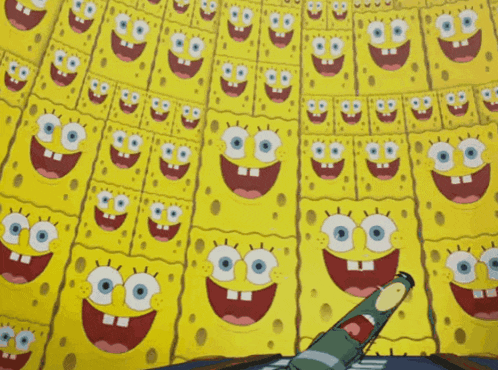 a bunch of spongebob squarepants faces are lined up on a wall