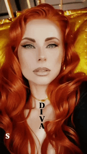 a woman with long red hair is wearing a necklace that says diva