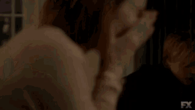 a blurry picture of a woman talking on a cell phone with the words bolsonaro 2018 written in the corner .