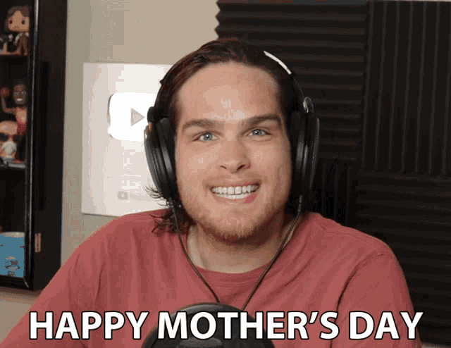 a man wearing headphones says " happy mother 's day " on the screen