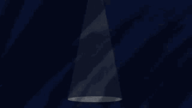 a spotlight is shining on a dark background with the words let all written on it .