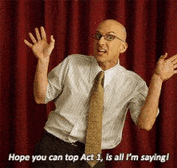 a bald man with glasses and a tie is saying hope you can top act 1 is all i 'm saying !