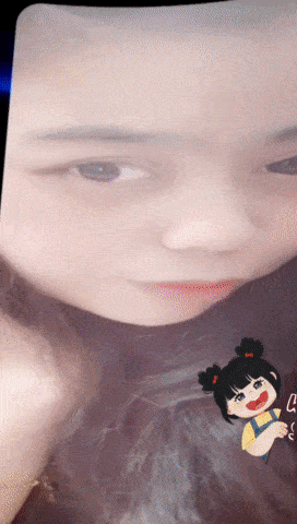 a close up of a girl 's face with a cartoon girl on the bottom
