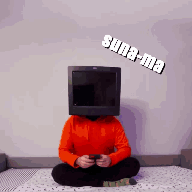 a person sitting on a bed with a tv on their head and the word suna-ma written on the wall behind them
