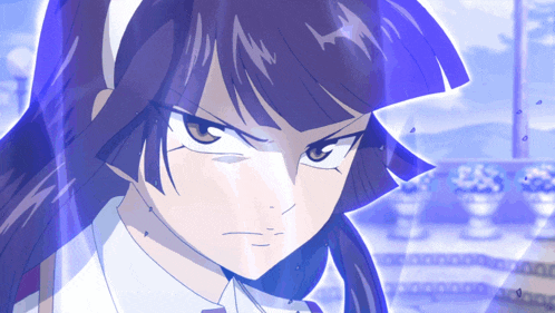 a close up of a girl 's face with a blue light behind her