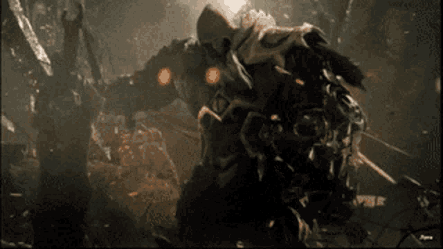 a video game character is fighting a monster in a dark cave