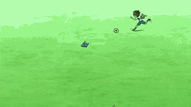 a boy in a white shirt and blue shorts is playing soccer