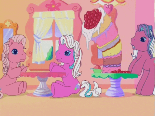 three ponies are sitting around a table with cakes on them