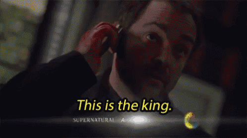 a man talking on a cell phone with the words " this is the king " on the bottom