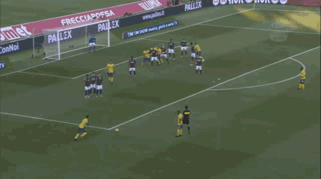 a soccer game is being played on a field with advertisements for comet and pallaex